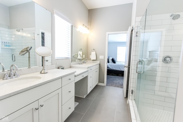 bathroom with tile patterned floors, an enclosed shower, and vanity