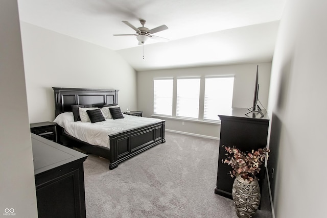 carpeted bedroom featuring lofted ceiling and ceiling fan