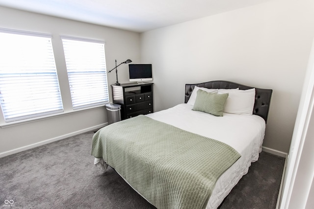 bedroom featuring dark colored carpet