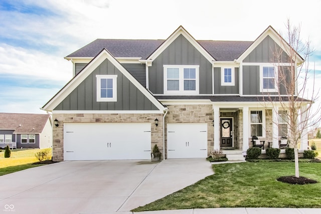 craftsman-style home featuring a garage and a front lawn