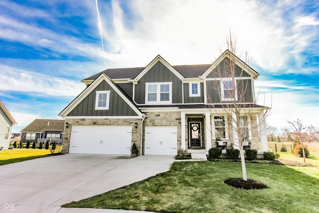 view of front of house featuring a garage and a front yard