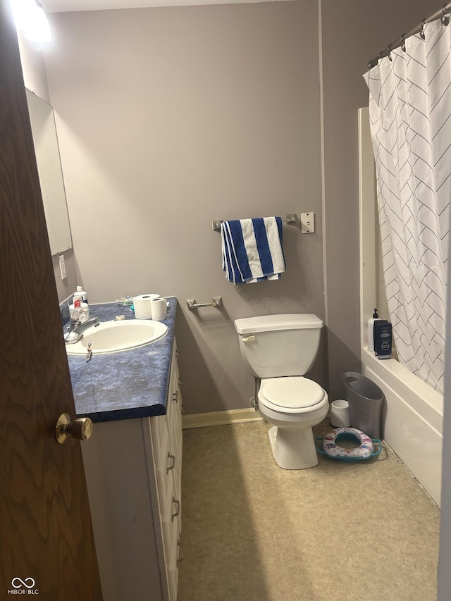 full bathroom featuring toilet, vanity, and shower / bathtub combination with curtain