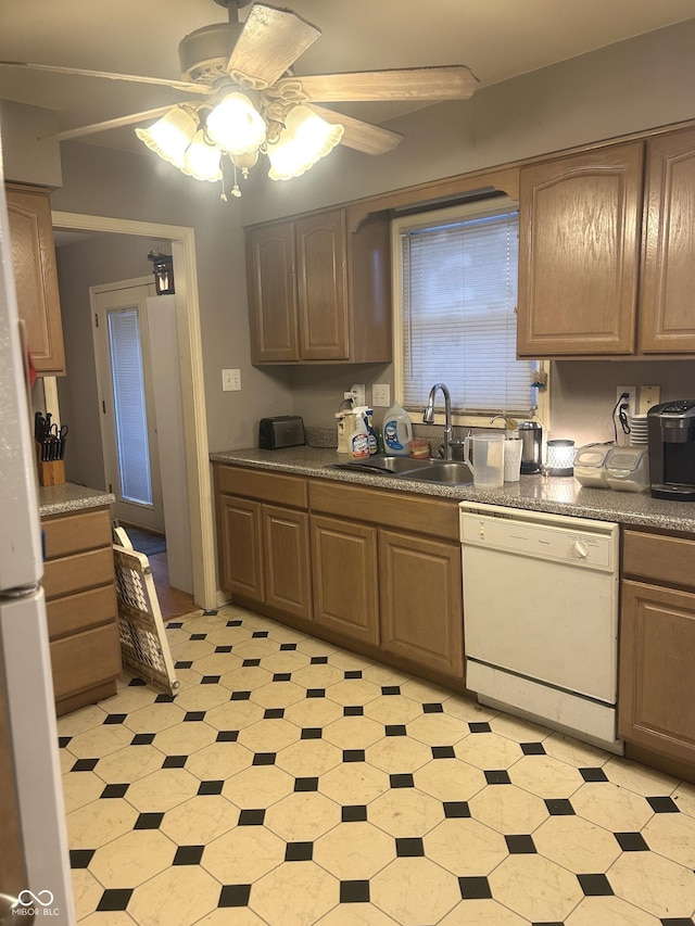 kitchen with ceiling fan, white dishwasher, and sink