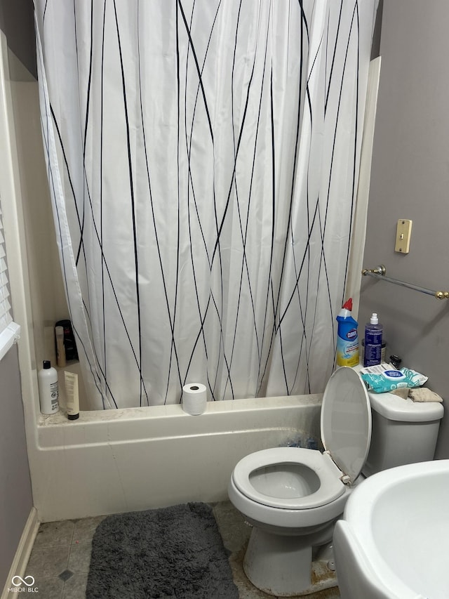 bathroom featuring tile patterned floors and toilet