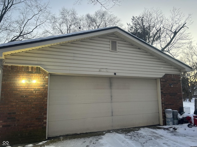 view of snow covered garage