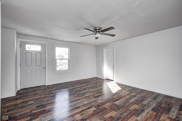 entrance foyer with ceiling fan and dark wood-type flooring