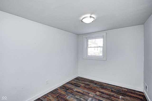 unfurnished room featuring dark hardwood / wood-style flooring