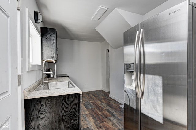 kitchen with stainless steel fridge, sink, and dark hardwood / wood-style flooring