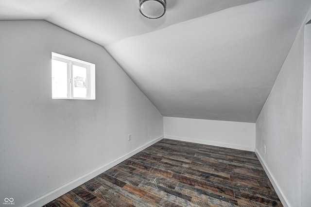 bonus room featuring dark hardwood / wood-style floors and lofted ceiling