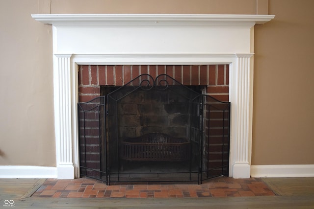 details featuring a fireplace and hardwood / wood-style flooring