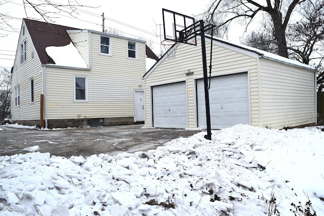 view of snow covered garage