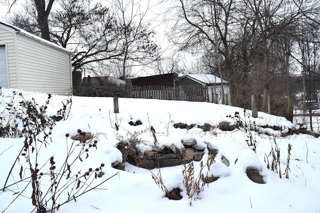 view of yard covered in snow