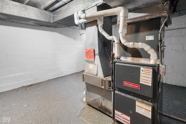 utility room featuring heating unit