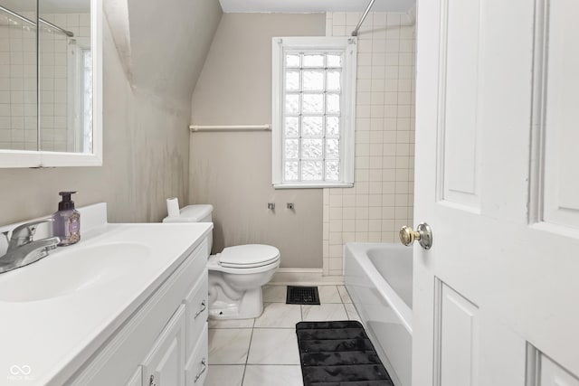 full bathroom with toilet, vanity, tile patterned floors, and tiled shower / bath combo