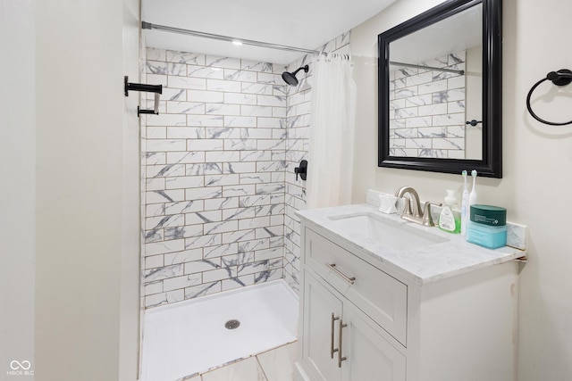 bathroom featuring vanity and a shower with shower curtain