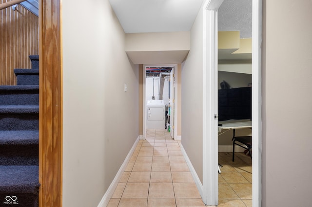 hallway featuring light tile patterned floors