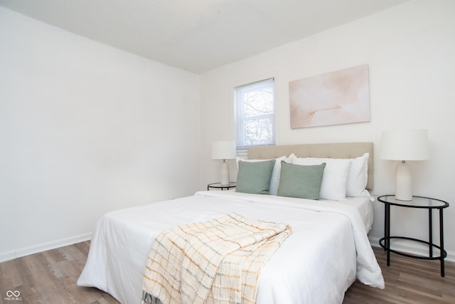 bedroom with wood-type flooring