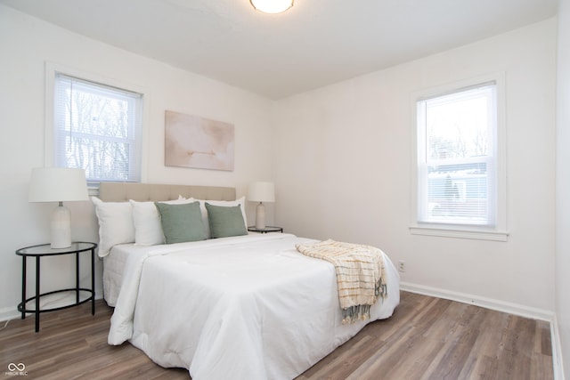 bedroom with hardwood / wood-style floors