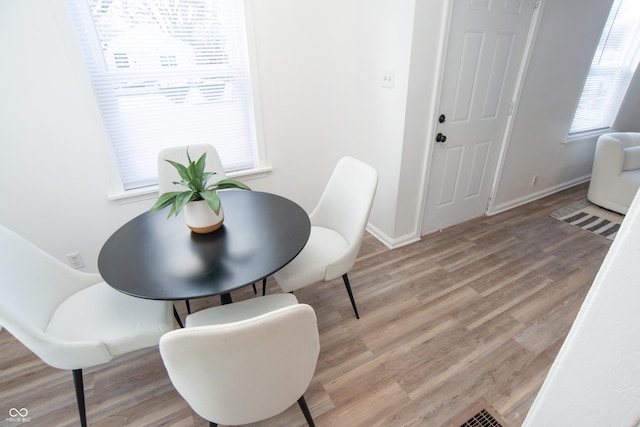 dining room featuring wood-type flooring