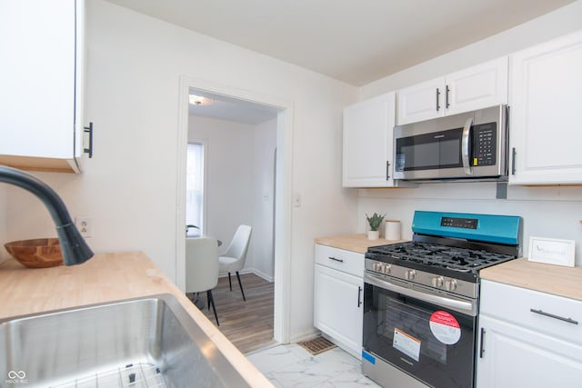 kitchen with white cabinets and stainless steel appliances