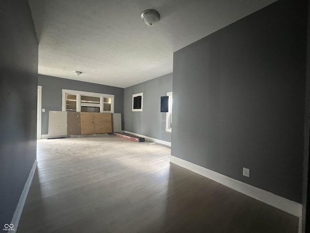 unfurnished living room with hardwood / wood-style flooring