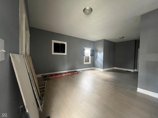 unfurnished room featuring wood-type flooring