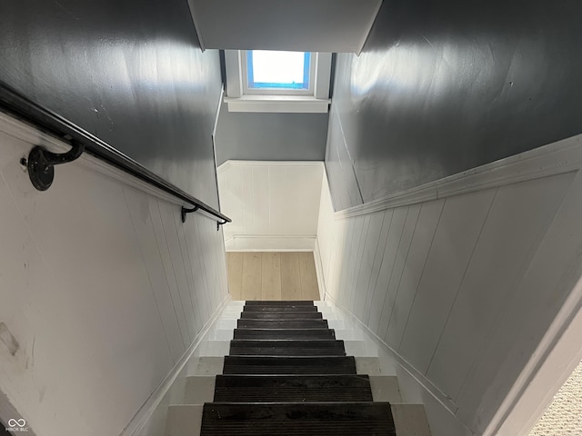 stairs with hardwood / wood-style flooring