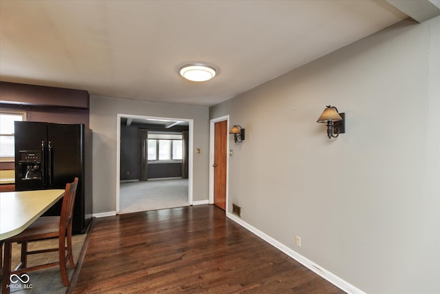 unfurnished dining area with dark hardwood / wood-style floors