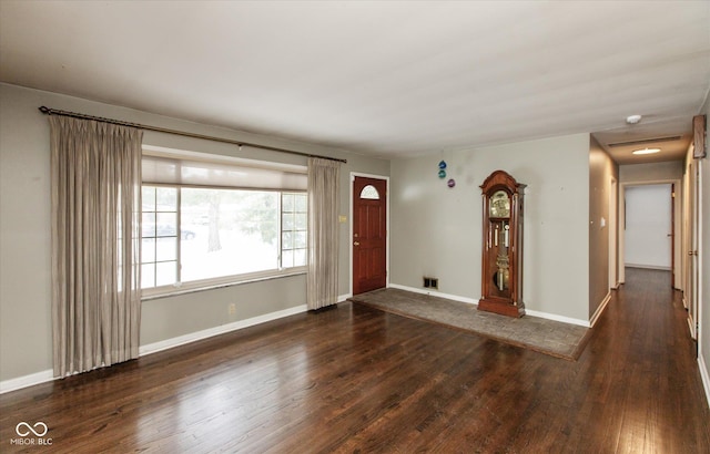 foyer entrance with dark hardwood / wood-style flooring