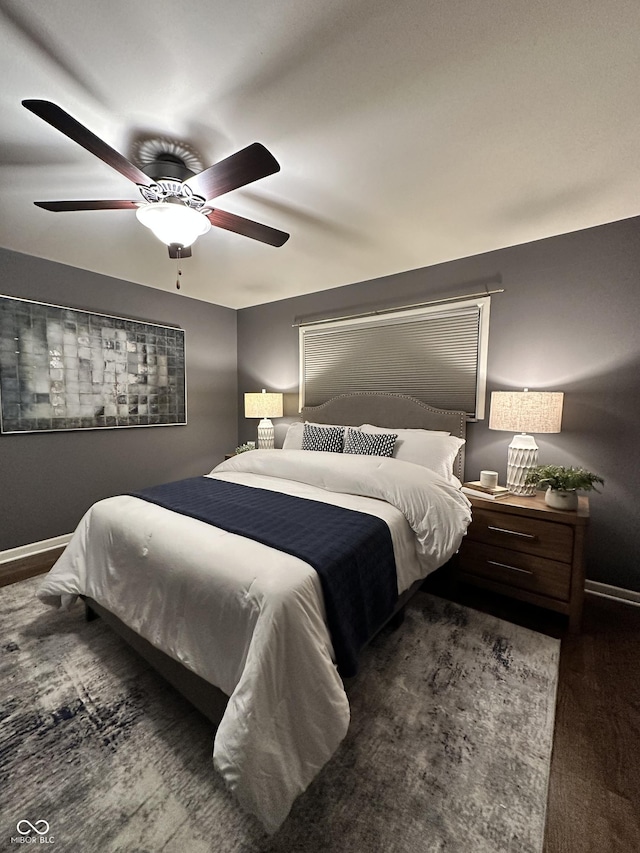 bedroom featuring dark hardwood / wood-style floors and ceiling fan