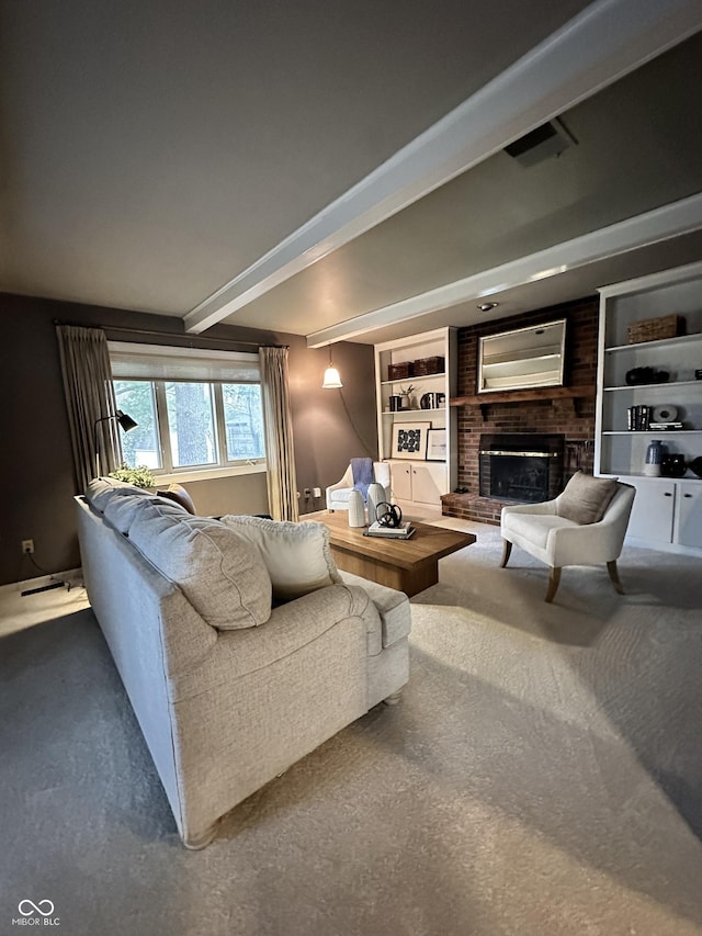 living room with a brick fireplace, carpet floors, beam ceiling, and built in shelves