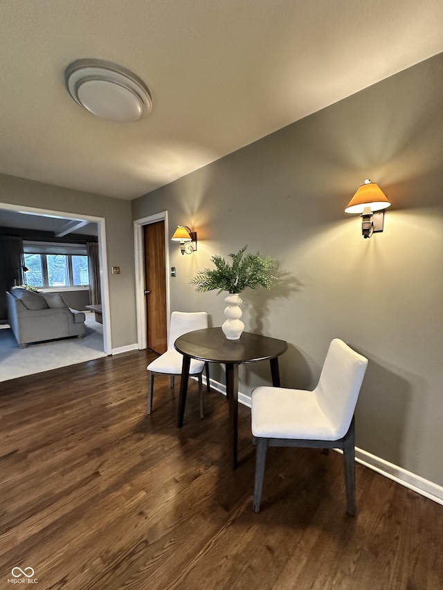 dining area featuring dark hardwood / wood-style flooring