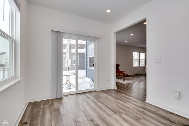 spare room featuring light wood-type flooring