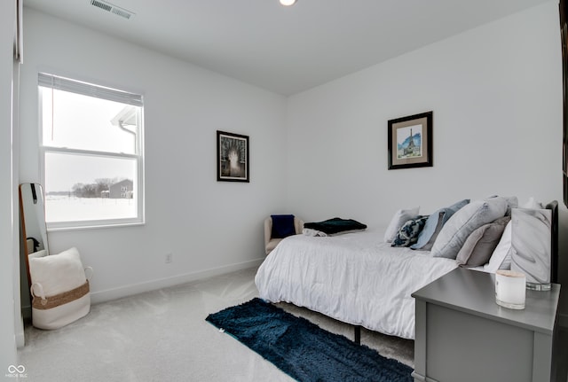 bedroom with light carpet