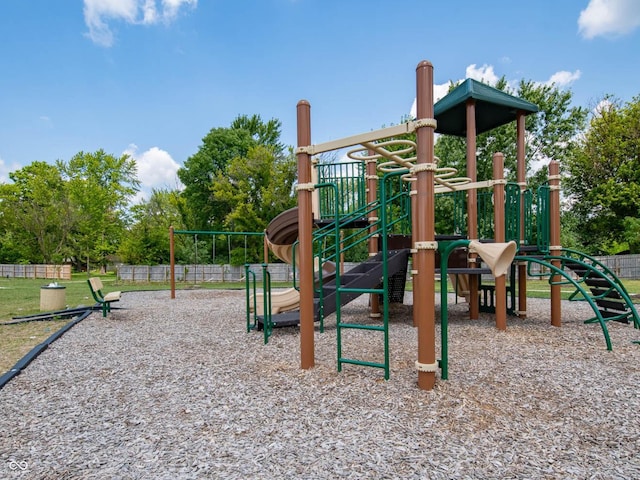 community jungle gym featuring fence