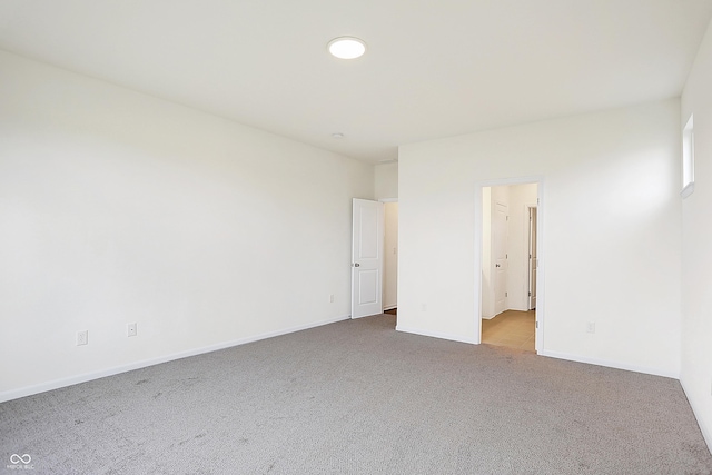 spare room with light colored carpet