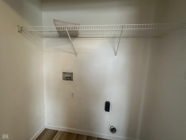 washroom featuring hookup for a washing machine, hookup for an electric dryer, and hardwood / wood-style floors