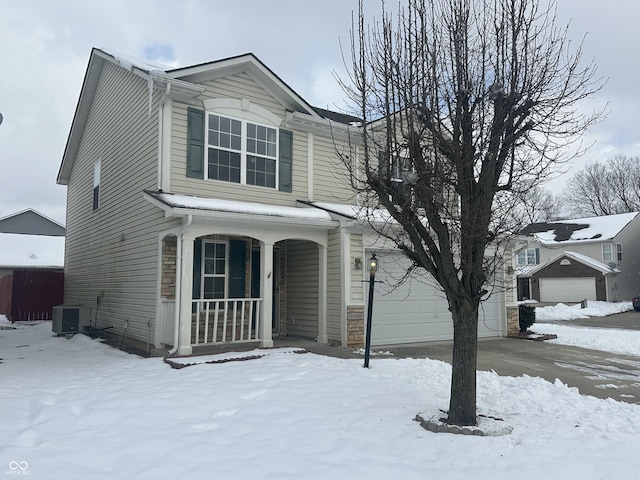 view of property with a garage and central AC unit