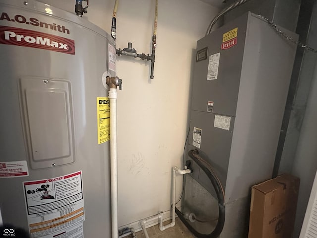 utility room featuring water heater and heating unit