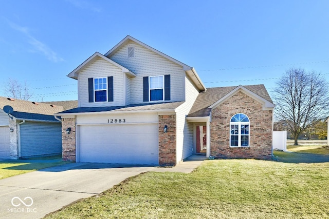 view of property with a garage and a front lawn