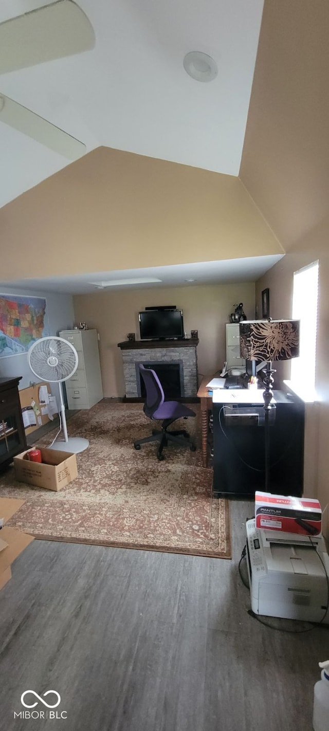 interior space with vaulted ceiling and hardwood / wood-style flooring