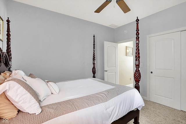 bedroom with carpet floors, ceiling fan, and a closet