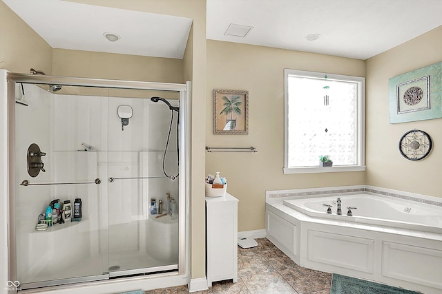 bathroom featuring separate shower and tub