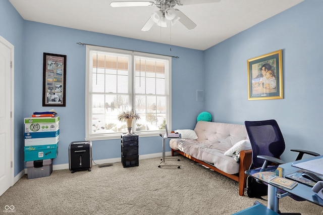 carpeted office featuring ceiling fan