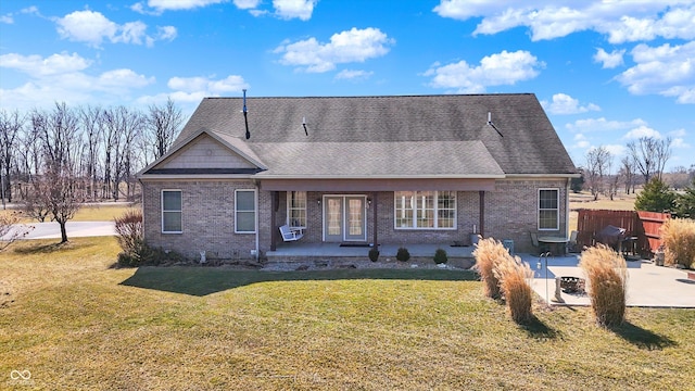 10194 E 900 N, Markleville, IN 46056 - rear view of property featuring a patio area, fence, brick siding, a shingled roof, and a lawn