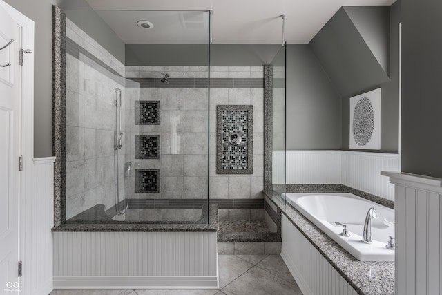 bathroom featuring tile patterned floors and separate shower and tub