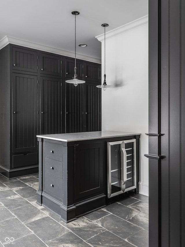 bar featuring wine cooler, decorative light fixtures, and ornamental molding