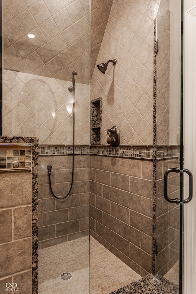 bathroom with a shower with shower door