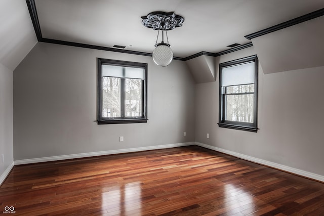 bonus room with dark hardwood / wood-style flooring and lofted ceiling