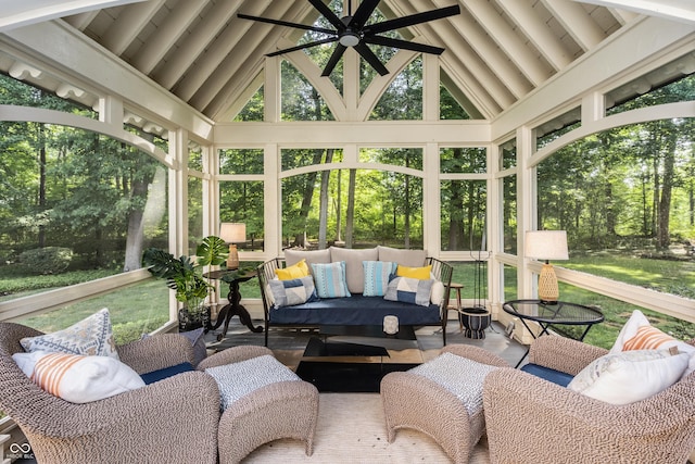 sunroom / solarium with ceiling fan and lofted ceiling